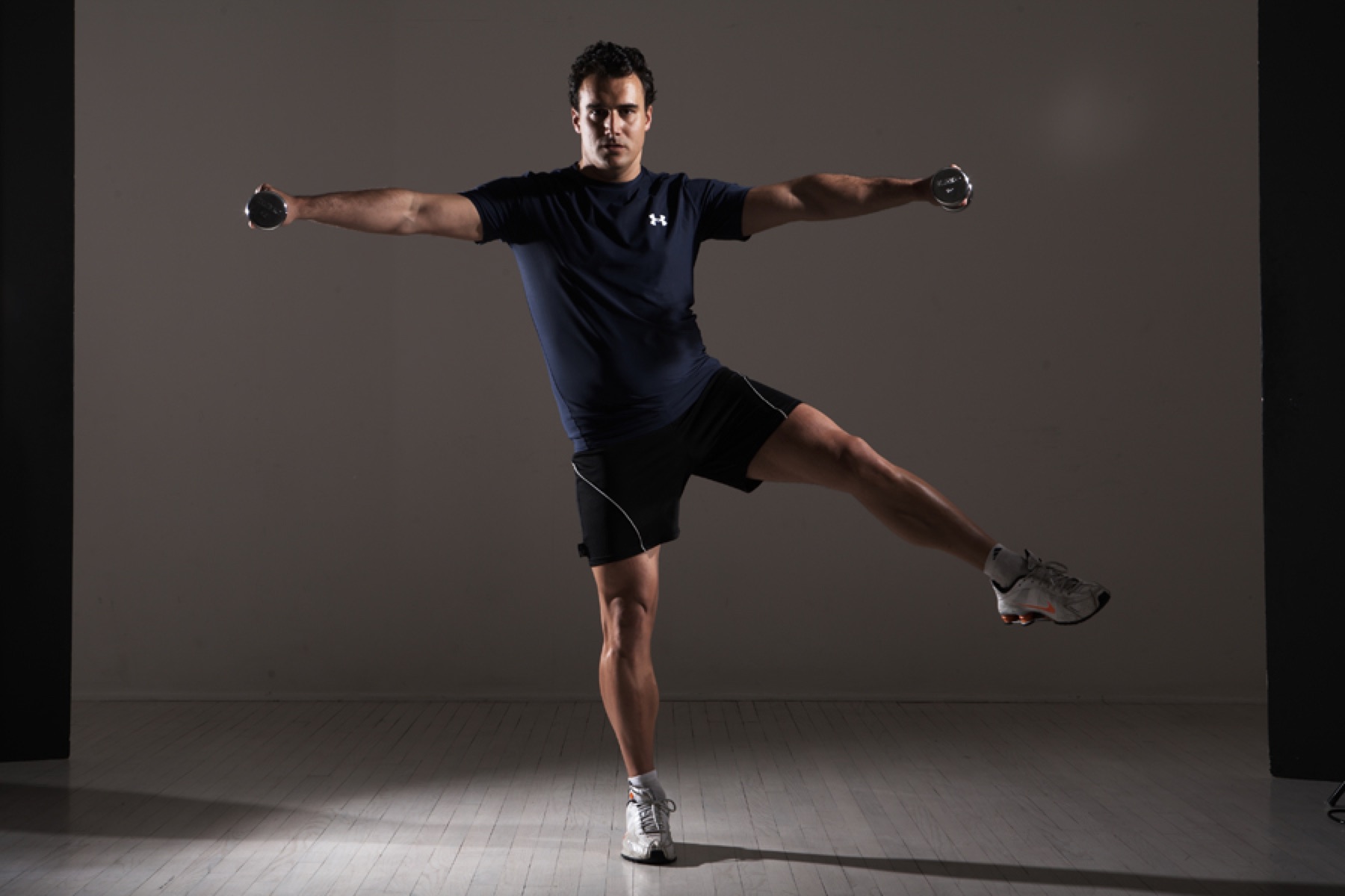 Michael combining arm movement with a balancing exercise