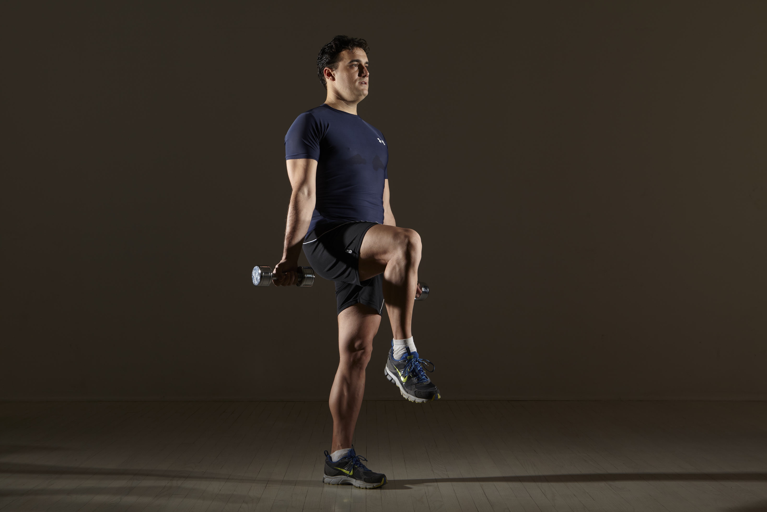 Michael Gonzalez-Wallace demonstrating a balance movement with weights